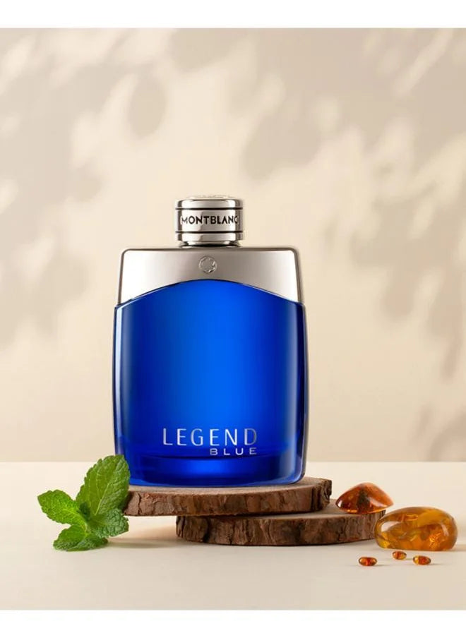 Montblanc Legend Blue perfume bottle on a wooden coaster showcasing fragrance notes