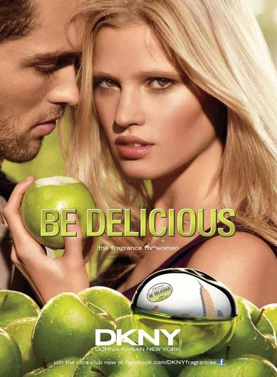 Advertisement for DKNY Be Delicious featuring a woman holding a green apple with a man in the background
