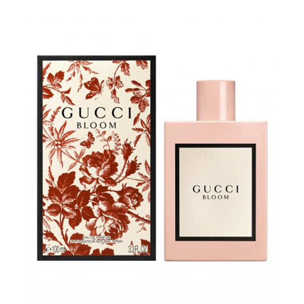 Gucci Bloom perfume bottle and packaging with floral design on a white background