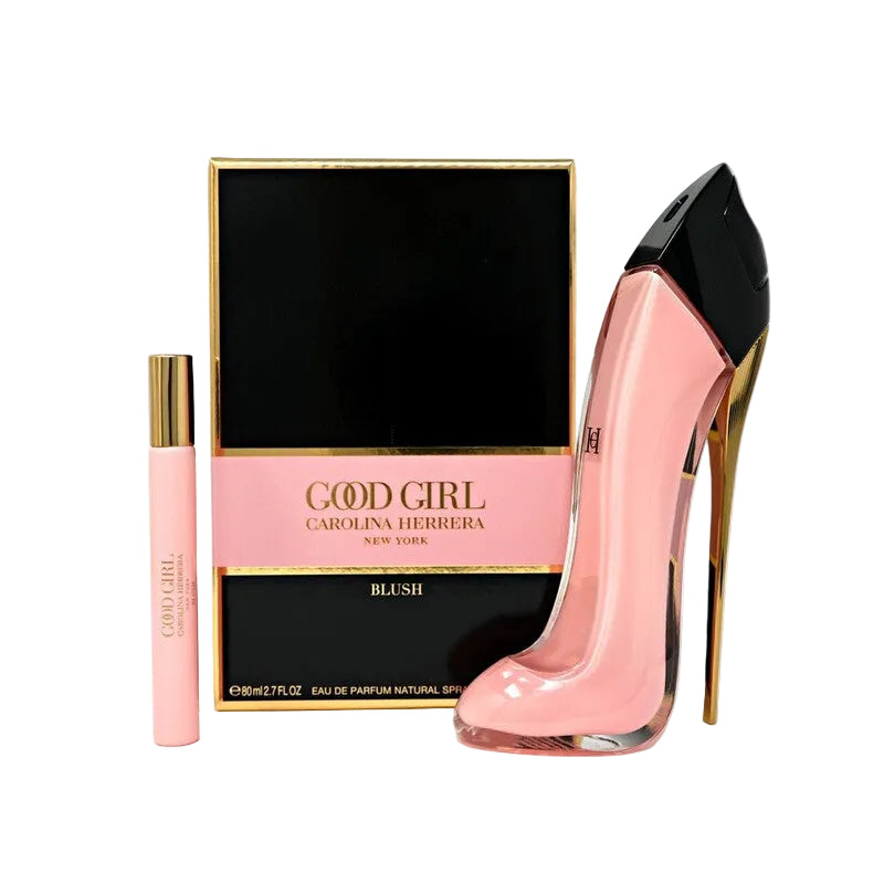 Carolina Herrera Good Girl Blush Eau de Parfum set, featuring a pink high-heeled perfume bottle designed like a stiletto, a small pink spray vial with a gold cap, and the black and gold retail box on a white background.