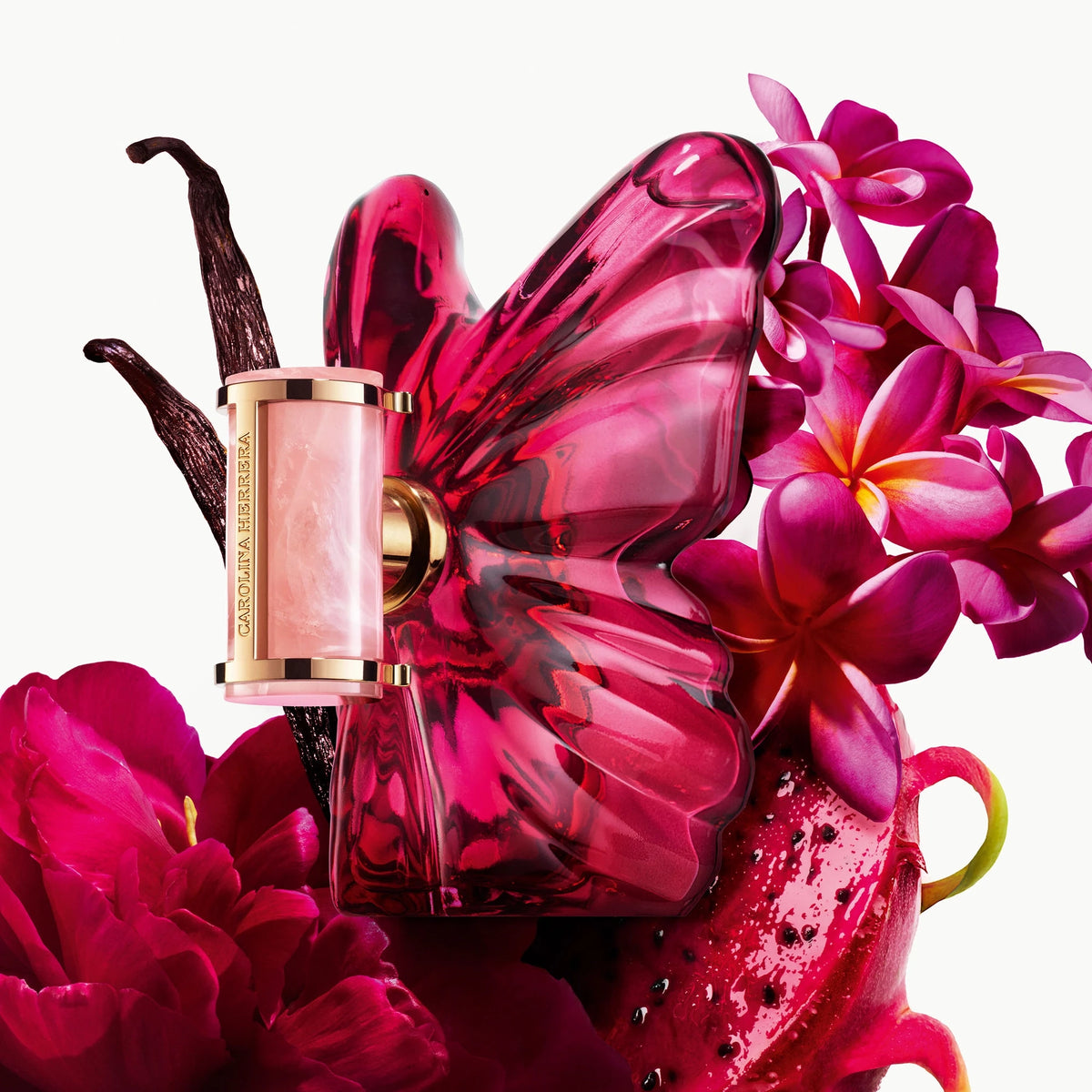 Carolina Herrera La Bomba Eau de Parfum set with 80ml and 10ml in the iconic butterfly-shaped fuchsia bottle with rose quartz stone and golden Insignia cap