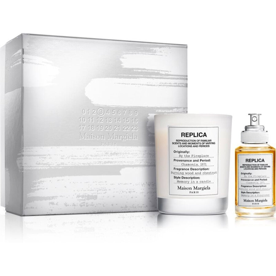 Maison Margiela By The Fireplace fragrance set with box, bottle, and jar on a white background
