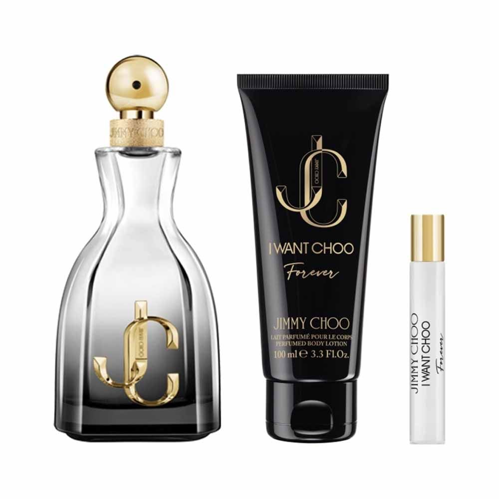 Close-up of Jimmy Choo I Want Choo Forever perfume bottles and body lotion featuring black and gold design