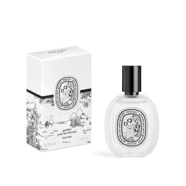 Diptyque hair mist bottle and packaging on a white background