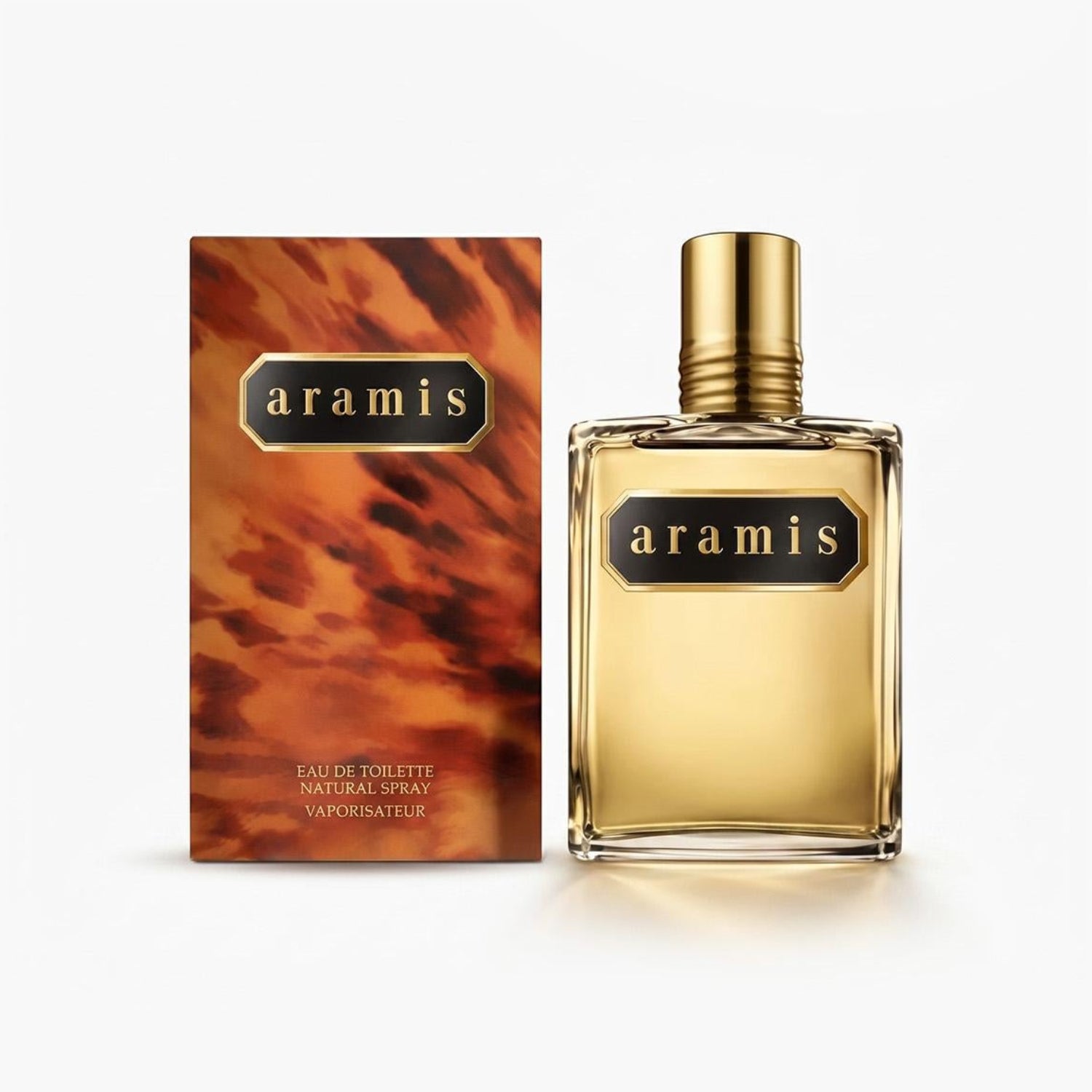 Aramis Eau de Toilette Natural Spray bottle with a gold cap next to its textured orange-brown box, on a clean white background.