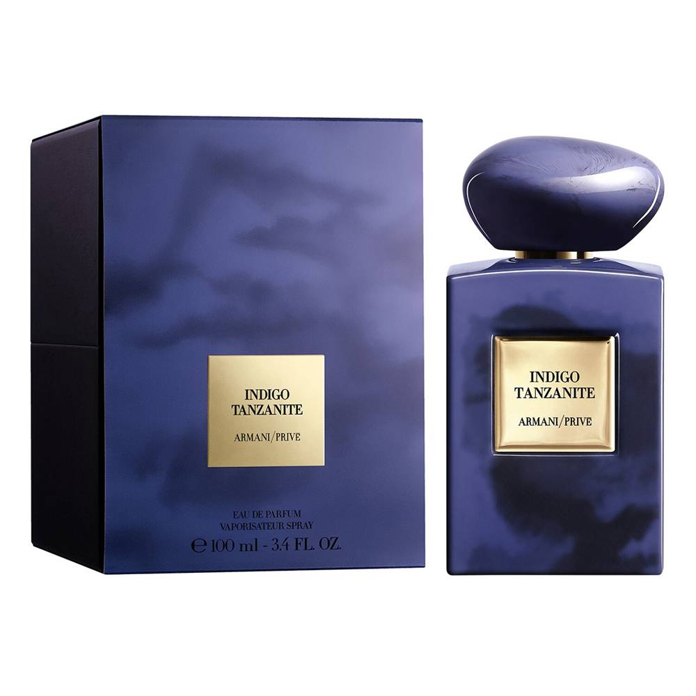 Armani Prive Indigo Tanzante Eau de Parfum, showing the dark blue glass bottle with a gold label next to its matching dark blue box on a white background.