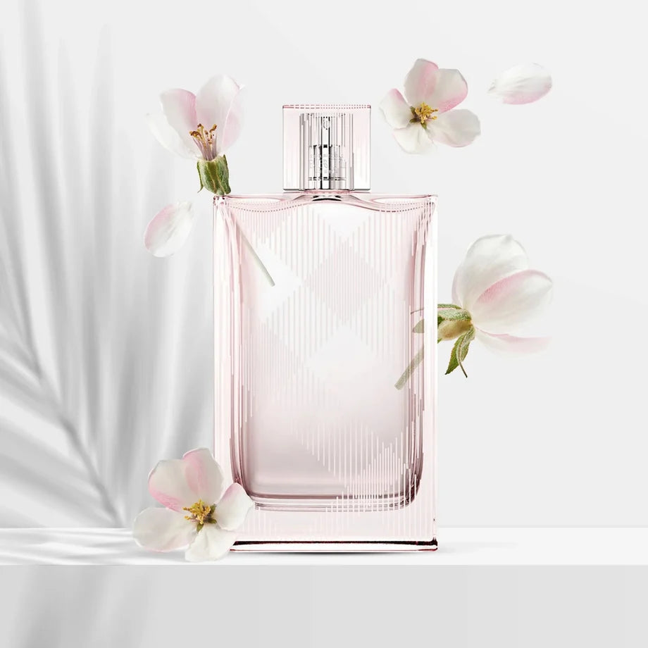 Burberry Brit Sheer bottle with floral elements on a light background
