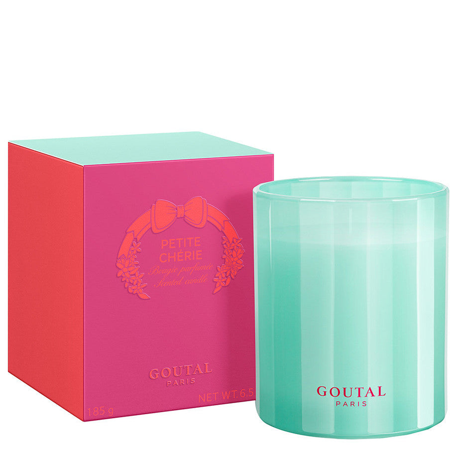 Turquoise candle with pink packaging featuring 'Goutal' branding on a white background