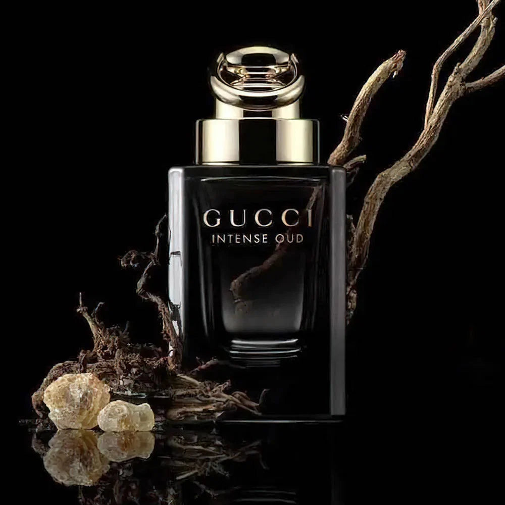 Gucci Intense Oud perfume bottle with natural elements on a black background