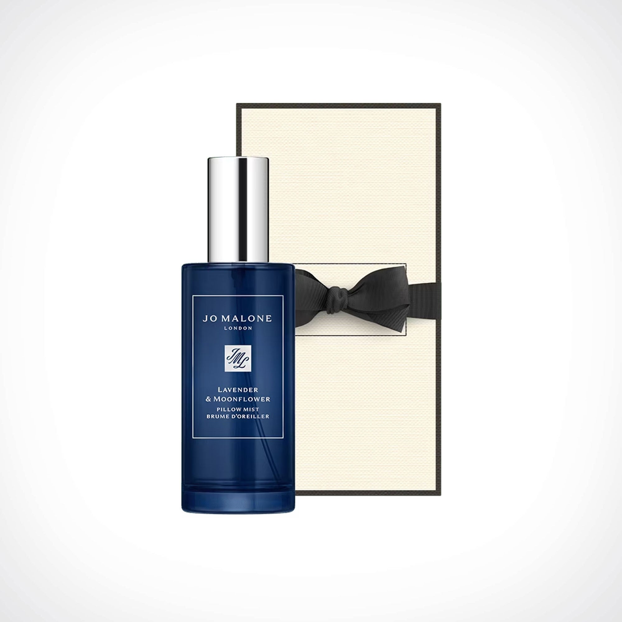 Jo Malone London Lavender & Moonflower Pillow Mist in a dark blue bottle with a silver cap, shown next to its cream-colored box with a black bow tie.